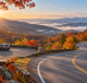Autumn forest and Appalachian hills beside a winding road and a designated scenic overlook