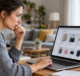 Online shopper carefully reviewing a store on a laptop
